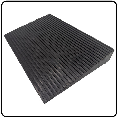 Black rubber mat with ribbed texture on a white background