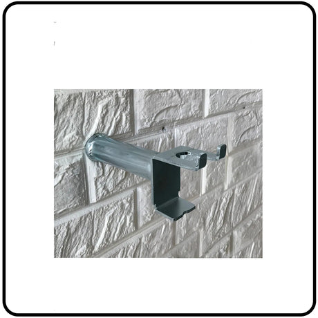 Metal bracket attached to a textured white wall